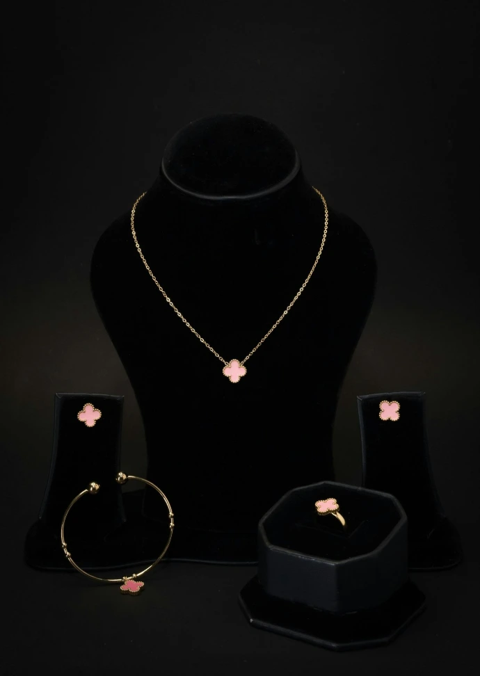 A necklace, bracelet, ring and earring set